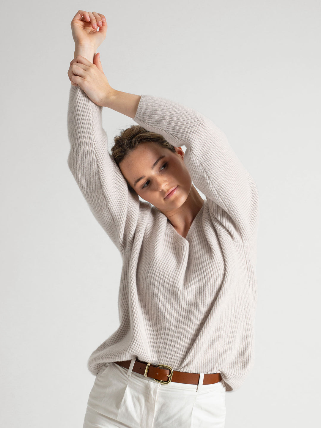 Rib knitted V-neck cashmere sweater in color: Cold Creme. 100% cashmere, Scandinavian design by Kashmina.Rib knitted V-neck cashmere sweater in color: Cold Creme. 100% cashmere, Scandinavian design by Kashmina.