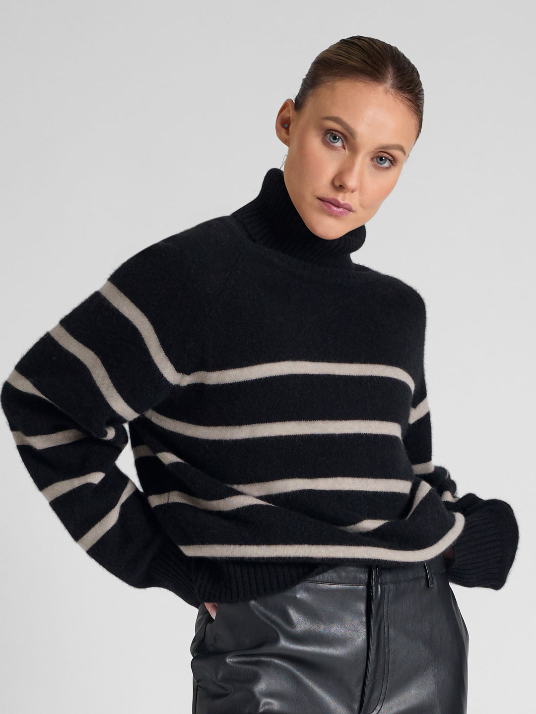 Turtleneck cashmere sweater with stripes. 100% pure cashmere. Scandinavian design by Kashmina. Color: Black, ginger.
