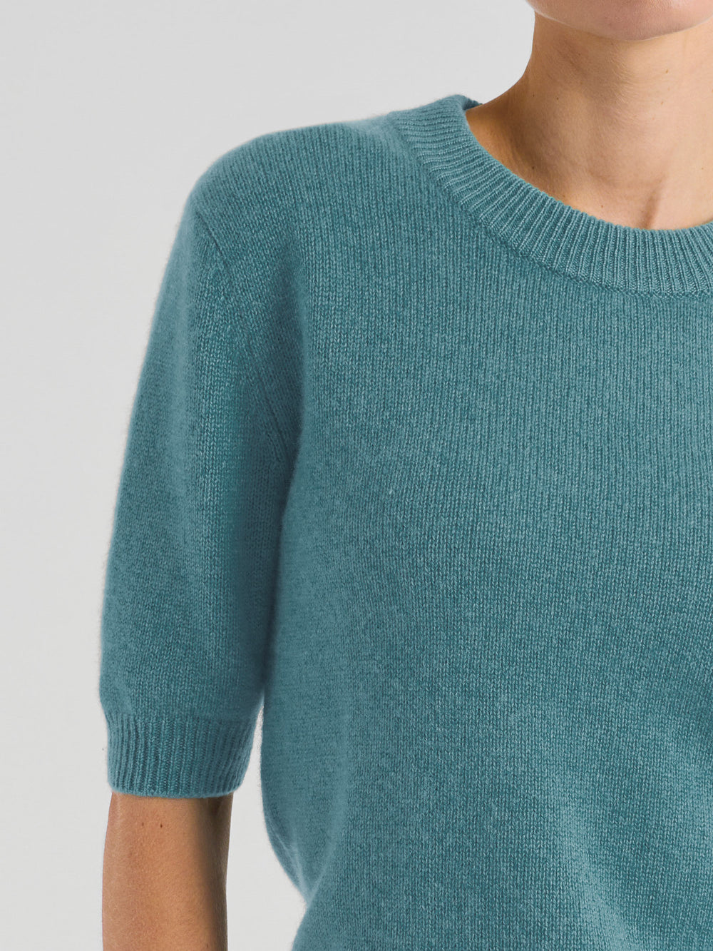 Short sleeved, round necked cashmere sweater in  100% pure cashmere. Scandinavian design by Kashmina. Color: Arctic blue, Turquoise.