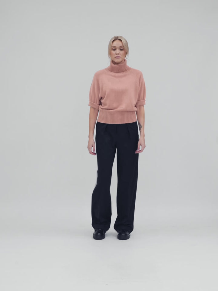 Short sleeved turtle neck cashmere sweater. Color Peachy Pink. Scandinavian design by Kashmina