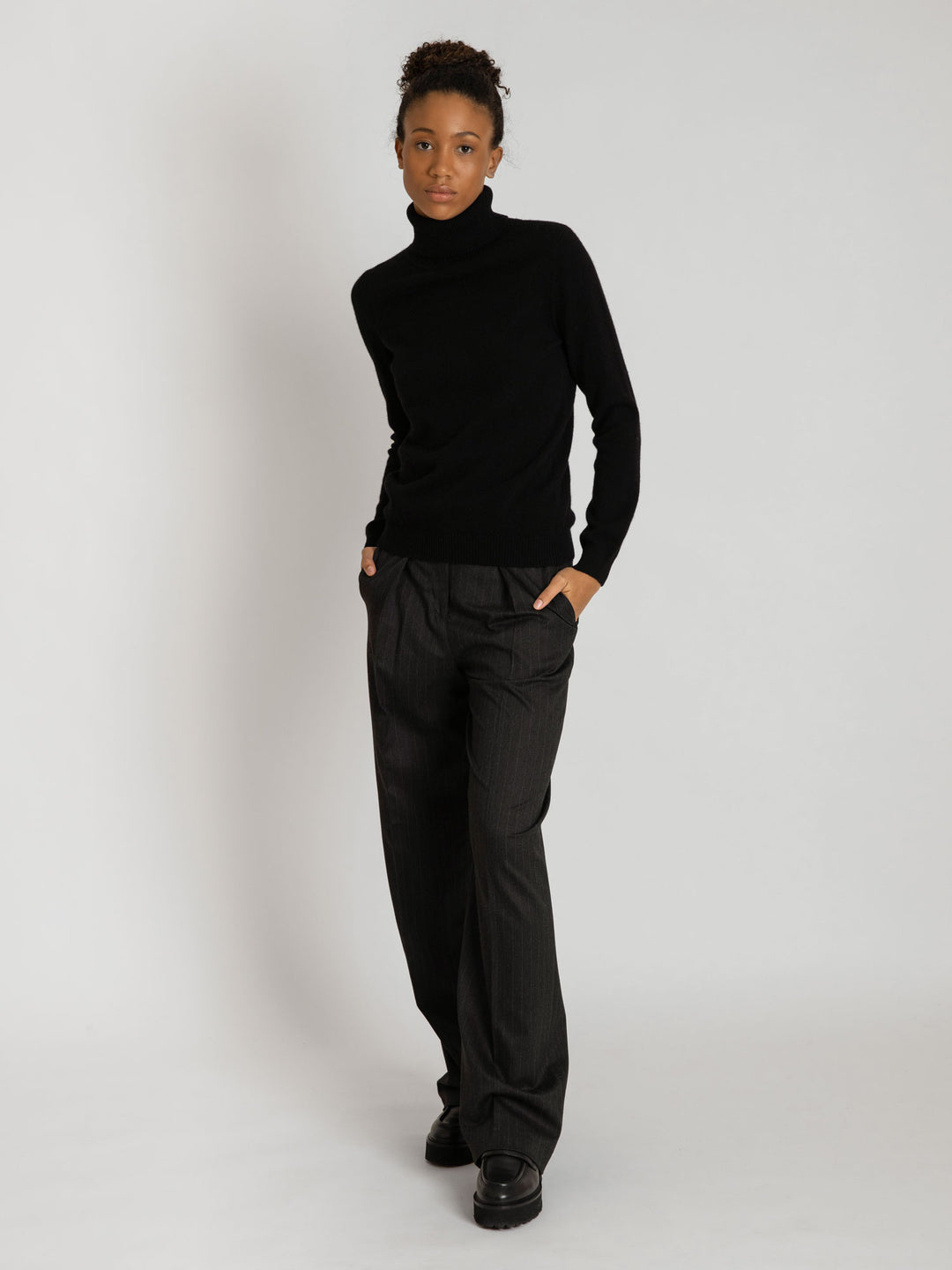 Turtleneck cashmere sweater, black color. 100% pure cashmere. Scandinavian design by KASHMINA of Norway.