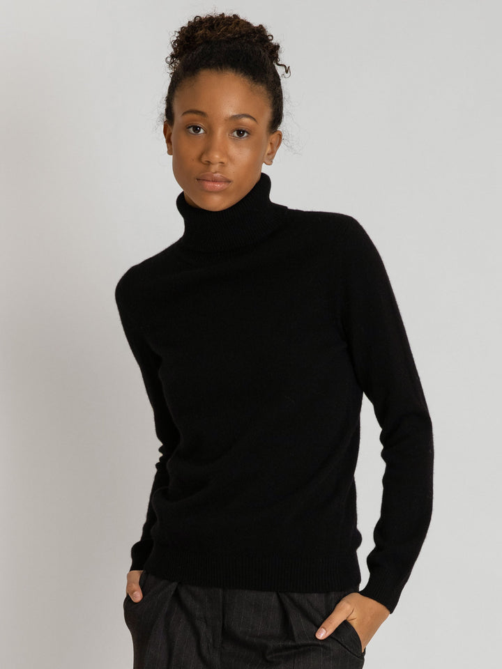 Turtleneck cashmere sweater, black color. 100% pure cashmere. Scandinavian design by KASHMINA of Norway.