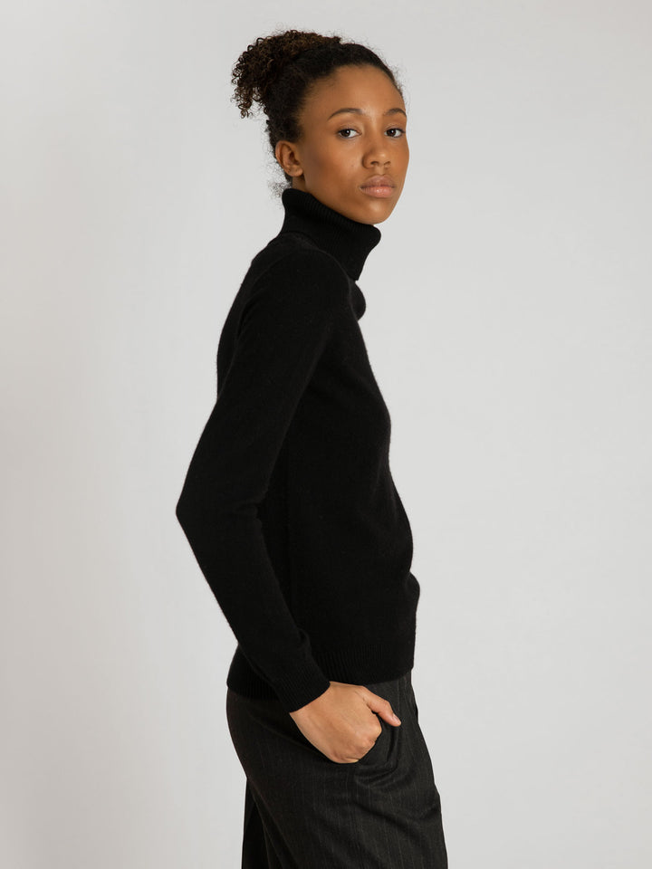 Turtleneck cashmere sweater, black color. 100% pure cashmere. Scandinavian design by KASHMINA of Norway.