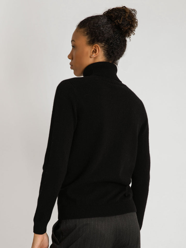 Turtleneck cashmere sweater, black color. 100% pure cashmere. Scandinavian design by KASHMINA of Norway.